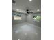 Large bright bedroom with big windows and modern ceiling fan at 6332 Emerson S Ave, St Petersburg, FL 33707
