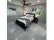 Inviting bedroom with great natural light, ceiling fan, two windows and modern furniture arrangement at 6332 Emerson S Ave, St Petersburg, FL 33707