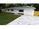 Charming, fully renovated home featuring a stylish driveway and freshly landscaped front yard at 6332 Emerson S Ave, St Petersburg, FL 33707