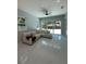 Cozy living room with a large sectional couch and a sliding glass door to the backyard at 6332 Emerson S Ave, St Petersburg, FL 33707