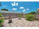 Private fenced backyard with a paver patio and mature plantings at 6400 46Th N Ave # 61, Kenneth City, FL 33709