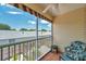 Balcony with a view, seating, a ceiling fan, and a striped awning at 6400 46Th N Ave # 61, Kenneth City, FL 33709