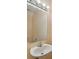 Modern half-bath with pedestal sink, stylish mirror, and ample lighting at 6400 46Th N Ave # 61, Kenneth City, FL 33709