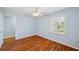 Bright bedroom with wood floors and plantation shutters on the window at 6400 46Th N Ave # 61, Kenneth City, FL 33709