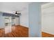 Bright bedroom with wood floors, a ceiling fan, and a walk-in closet at 6400 46Th N Ave # 61, Kenneth City, FL 33709