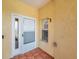 Welcoming entryway with a secure door and side window at 6400 46Th N Ave # 61, Kenneth City, FL 33709