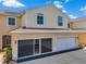 Charming townhouse showcasing an attached garage and private driveway at 6400 46Th N Ave # 61, Kenneth City, FL 33709