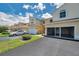 Lovely exterior view of a townhouse with an attached garage and well-manicured lawn at 6400 46Th N Ave # 61, Kenneth City, FL 33709