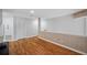 Hallway boasts wood-look floors, neutral walls, closet and offers easy access to rooms at 6400 46Th N Ave # 61, Kenneth City, FL 33709