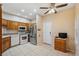 The kitchen features stainless steel appliances, oak cabinetry, and ample lighting at 6400 46Th N Ave # 61, Kenneth City, FL 33709