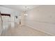 Open-concept living and dining area featuring tile flooring and natural light from large windows at 6400 46Th N Ave # 61, Kenneth City, FL 33709