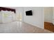 Bright living room with tile floors, window, and view of doors to outdoor at 6400 46Th N Ave # 61, Kenneth City, FL 33709