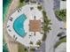 Overhead view of pool and surrounding lounge area, as well as lush landscaping in a lakeside setting at 6400 46Th N Ave # 61, Kenneth City, FL 33709
