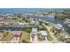 Aerial view of waterfront property with stunning canal views and easy access to the open water at 6543 Louise Ct, Hudson, FL 34667
