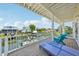 Balcony overlooking the canal with chairs and a chaise lounge and a beautiful view at 6543 Louise Ct, Hudson, FL 34667