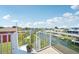 Enjoy serene canal views from this charming balcony with white railing overlooking the tranquil waterways at 6543 Louise Ct, Hudson, FL 34667