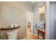 Rustic bathroom featuring stylish sink and shower, offering a cozy retreat at 6543 Louise Ct, Hudson, FL 34667