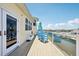 Relax on this spacious deck with canal views, outdoor seating and clear railing with access to the home's interior at 6543 Louise Ct, Hudson, FL 34667
