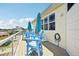 Upstairs deck featuring outdoor seating, clear railings to enjoy the views and convenient access to the home at 6543 Louise Ct, Hudson, FL 34667