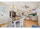 Dining area with table, chairs, and natural light, seamlessly connected to the living room and kitchen at 6543 Louise Ct, Hudson, FL 34667