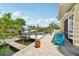 Waterfront patio and dock featuring seating and boat access, perfect for enjoying canal-front living at 6543 Louise Ct, Hudson, FL 34667