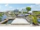 Private boat dock with boat lift offering direct access to the canal and waterfront views at 6543 Louise Ct, Hudson, FL 34667