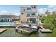 Beautiful waterfront home featuring a private boat dock and expansive balconies for enjoying the view at 6543 Louise Ct, Hudson, FL 34667