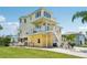 Elevated coastal home featuring multi-level decks and balconies, boat storage, and a meticulously maintained lawn at 6543 Louise Ct, Hudson, FL 34667