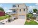 Stunning multi-story home with ample parking and water views, including multiple decks and a front yard at 6543 Louise Ct, Hudson, FL 34667
