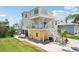 Charming coastal home featuring multi-level decks, boat storage, and lush landscaping with meticulous lawn at 6543 Louise Ct, Hudson, FL 34667