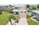 Charming two-story home with a brick driveway, attached garage, and balcony overlooking the waterway at 6543 Louise Ct, Hudson, FL 34667
