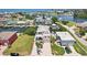 Waterfront home featuring lush landscaping, a brick driveway, two-story design, and canal access at 6543 Louise Ct, Hudson, FL 34667