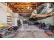 Spacious garage with ample storage for vehicles, surfboards, tools, and other equipment at 6543 Louise Ct, Hudson, FL 34667