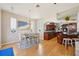 Spacious kitchen seamlessly connecting to the dining area, featuring cherry cabinets and a central island with seating at 6543 Louise Ct, Hudson, FL 34667