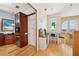 Cozy upper-level kitchenette featuring wood cabinets, a dining area, and picturesque window views at 6543 Louise Ct, Hudson, FL 34667