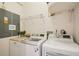 Bright laundry room with modern washer and dryer units for efficient laundry at 6543 Louise Ct, Hudson, FL 34667
