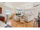 Comfortable living room with bright natural light, modern furniture, and views of the water at 6543 Louise Ct, Hudson, FL 34667