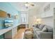 Comfortable living room with a sofa, built-in shelves, and a workspace for working from home at 6543 Louise Ct, Hudson, FL 34667