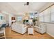 Bright living room featuring modern furnishings, hardwood floors, and views of the water at 6543 Louise Ct, Hudson, FL 34667