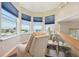 Cozy sitting area with bay window, plush chair and serene water view at 6543 Louise Ct, Hudson, FL 34667