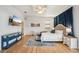 Open and spacious main bedroom with wood floors, large windows and an ensuite entrance at 6543 Louise Ct, Hudson, FL 34667