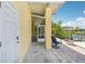 Covered patio with screened porch access, leading to the waterfront and boat dock; perfect for outdoor relaxation at 6543 Louise Ct, Hudson, FL 34667