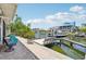 Charming waterfront patio with boat dock, offering serene canal views and direct access to boating at 6543 Louise Ct, Hudson, FL 34667