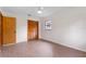 This bedroom features wood floors, a ceiling fan and a double closet at 6921 N 16Th St, Tampa, FL 33610