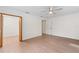 Bedroom walk-in closet with custom white wire shelving and wood-look floors at 6921 N 16Th St, Tampa, FL 33610