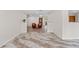 Open-concept living space with tile flooring and hardwood floors, perfect for entertaining at 6921 N 16Th St, Tampa, FL 33610