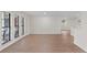 Spacious living room with ample natural light, hardwood floors, and large windows at 6921 N 16Th St, Tampa, FL 33610