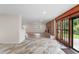Spacious living area with tile entry leading into a cozy living room with a fireplace at 6921 N 16Th St, Tampa, FL 33610