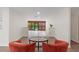 Living room with tile and wood flooring, bright walls, and a cozy seating arrangement at 6921 N 16Th St, Tampa, FL 33610