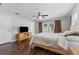 Serene bedroom features hardwood floors, a ceiling fan, and access to the outdoor patio at 7210 14Th N St, St Petersburg, FL 33702